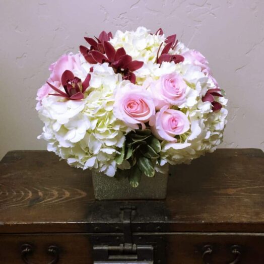 peonies and roses in a vase