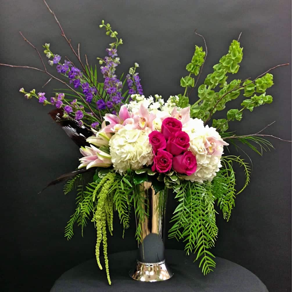 hydrangeas and roses in a large vase