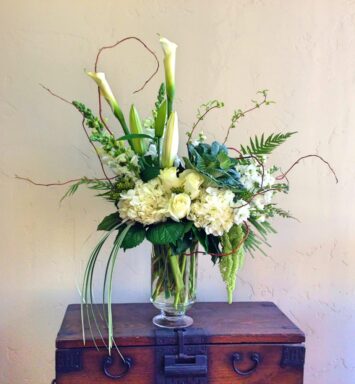 roses and calla lilies in a vase