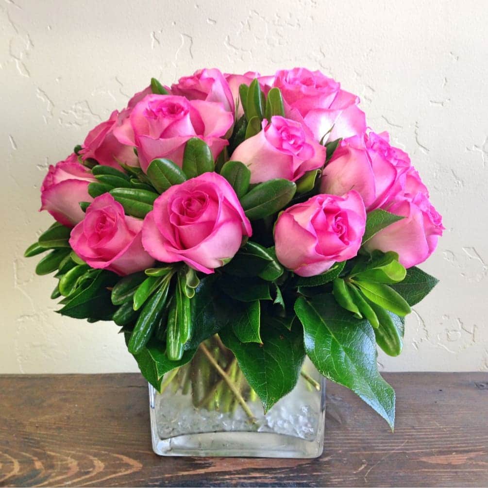 pink roses in a small vase
