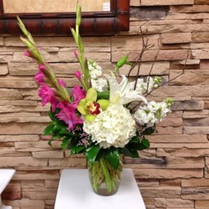 calla lilies, hydrangeas and orchids in vase