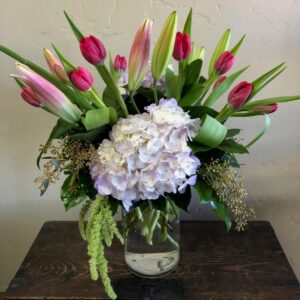 tulips, hydrangeas and lilies in a vase