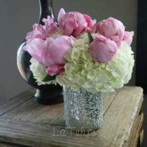 peonies and hydrangeas in a vase