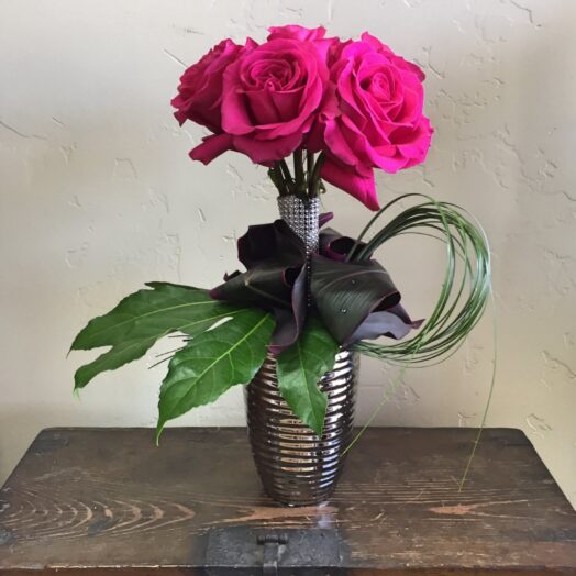 roses in a small vase