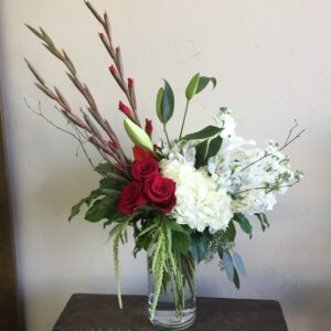roses, hydrangeas and greens in a vase