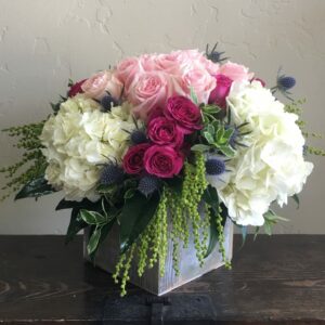 hydrangeas and roses in a vase