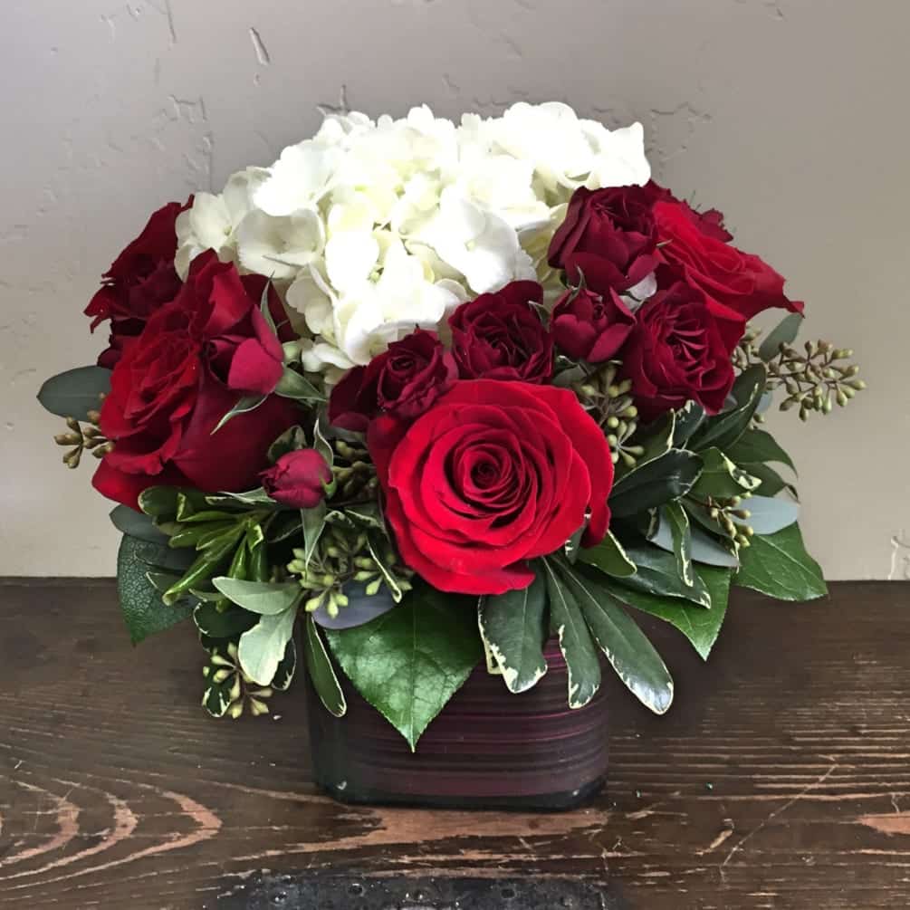 roses and hydrangeas in a vase