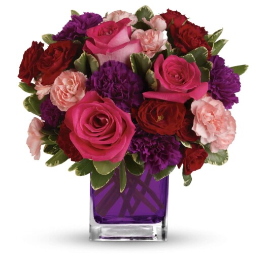 Hot pink roses, dark red spray roses, purple carnations and pink miniature carnations