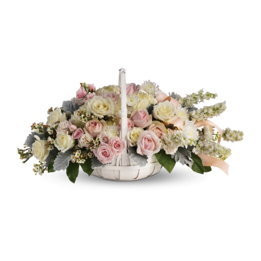 softly colored roses and chrysanthemums are nestled in a round white basket