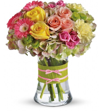 pink spray roses and mini gerberas, light yellow carnations in a vase