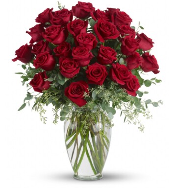 thirty red roses in a vase