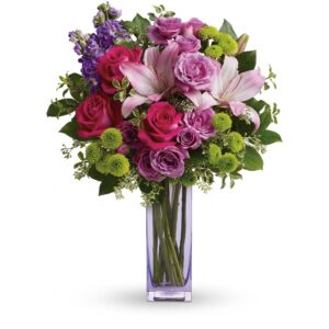 green lavender and purple flowers in a vase