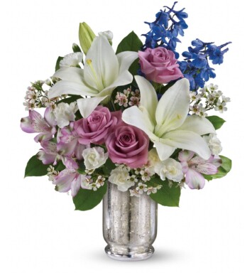 white blue and lavender flower in mercury vase