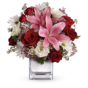 red roses and pink lilies in cube