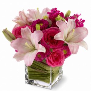 hot pink roses, pale pink lilies and mixed blossoms