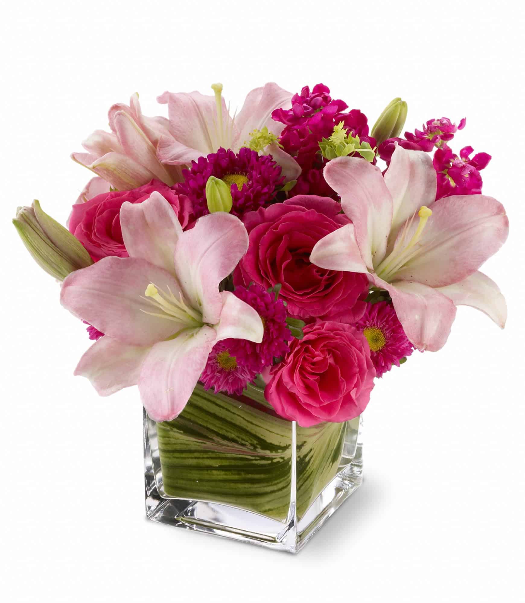 hot pink roses, pale pink lilies and mixed blossoms