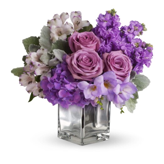 roses and hydrangea in a cube