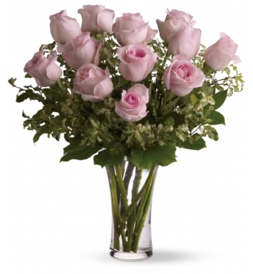 one dozen pink roses in a vase