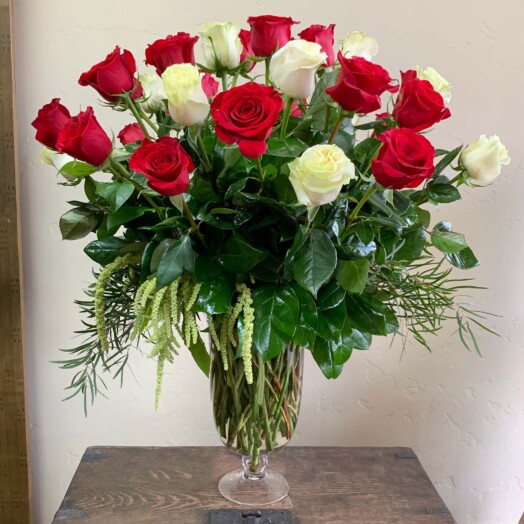 Red and White roses in a glass vase